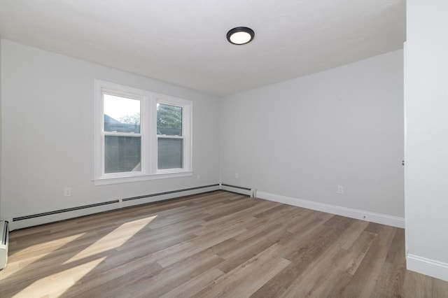 7 Cliff St, Attleboro, MA 02703 - spare room with baseboard heating and wood finished floors