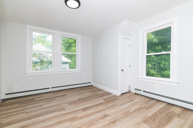 7 Cliff St, Attleboro, MA 02703 - unfurnished room featuring a baseboard heating unit and light wood-style floors