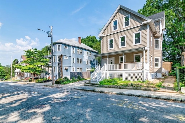 7 Cliff St, Attleboro, MA 02703 - view of front facade with a porch and stairway