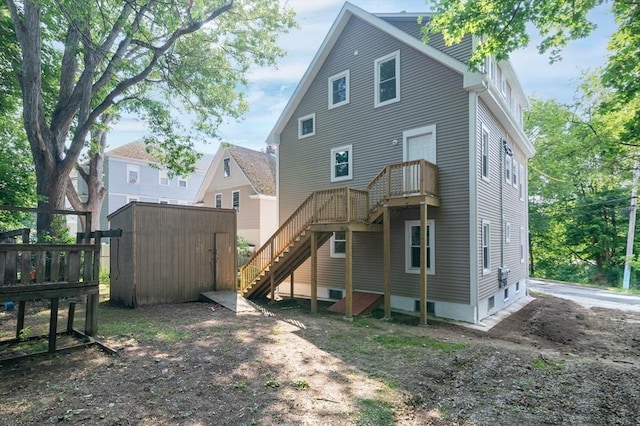 7 Cliff St, Attleboro, MA 02703 - back of house featuring stairway, a storage unit, and a deck