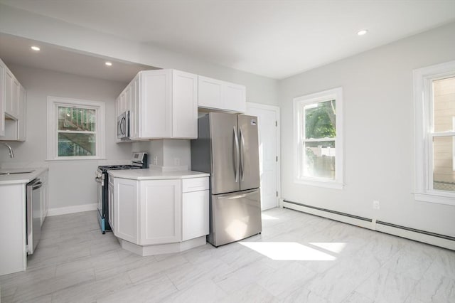 7 Cliff St, Attleboro, MA 02703 - kitchen with appliances with stainless steel finishes, a baseboard radiator, light countertops, white cabinetry, and recessed lighting