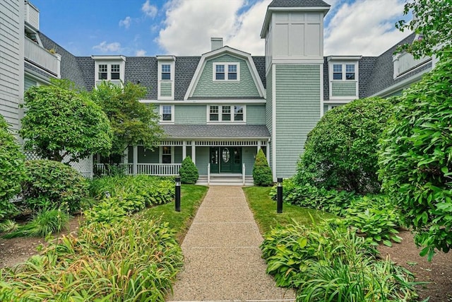 37 Hastings St Unit 207, Boston, MA 02132 - view of front of house with a porch and roof with shingles