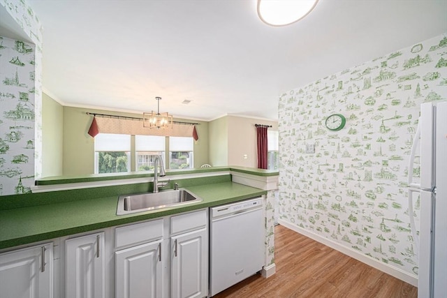 37 Hastings St Unit 207, Boston, MA 02132 - kitchen featuring white appliances, wallpapered walls, light wood-style flooring, dark countertops, and white cabinets