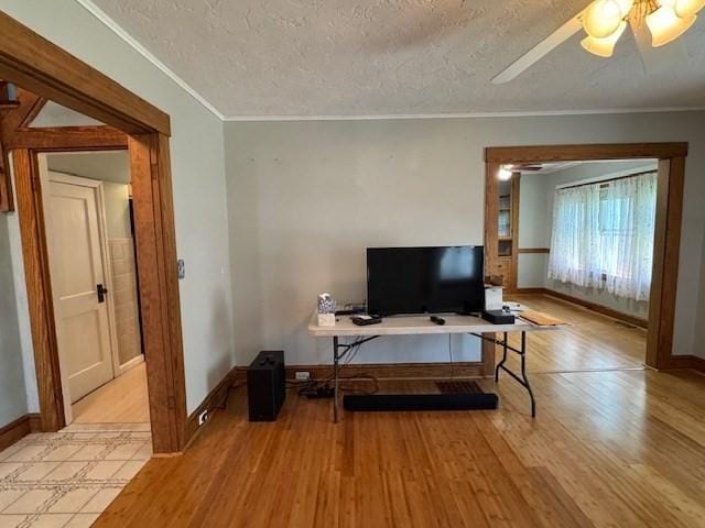 17 Olcott St, Watertown, MA 02472 - office space featuring ornamental molding, baseboards, light wood-type flooring, a textured ceiling, and a ceiling fan