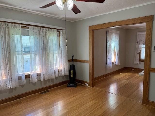 17 Olcott St, Watertown, MA 02472 - spare room with baseboards, a ceiling fan, and wood finished floors