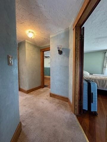 17 Olcott St, Watertown, MA 02472 - corridor featuring carpet flooring, a textured ceiling, and baseboards