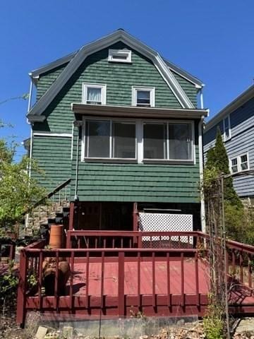 17 Olcott St, Watertown, MA 02472 - rear view of house featuring a wooden deck and a gambrel roof