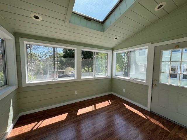 17 Olcott St, Watertown, MA 02472 - unfurnished sunroom featuring a wealth of natural light, lofted ceiling with skylight, and wood finished floors