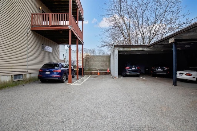 view of car parking with a carport and a garage