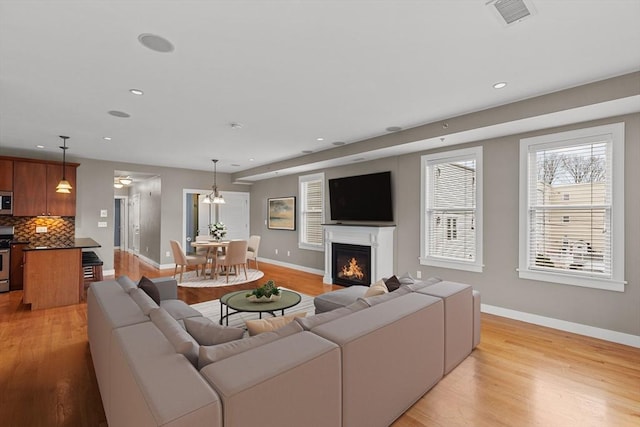 living room with light hardwood / wood-style floors