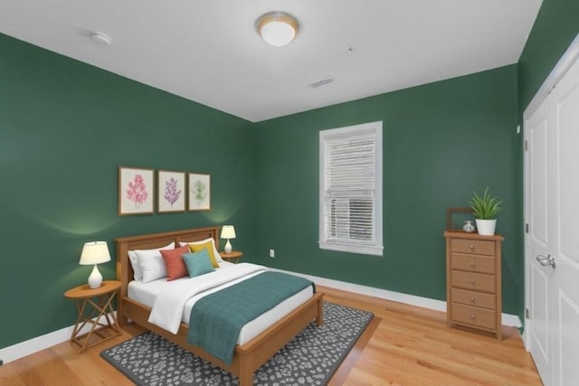 bedroom with light wood-type flooring