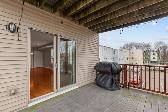 wooden terrace with area for grilling