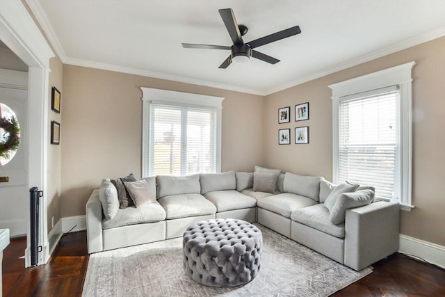 living room featuring ceiling fan, dark parquet flooring, and ornamental molding