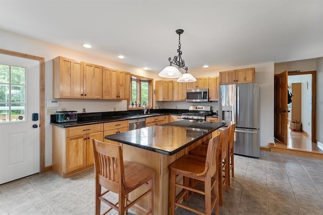39 Grey Fox Lndg, Woodstock, CT 06281 - kitchen featuring appliances with stainless steel finishes, a breakfast bar, a kitchen island, recessed lighting, and hanging light fixtures