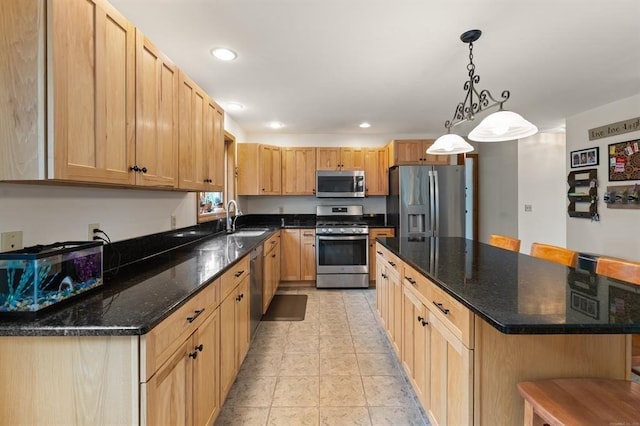 39 Grey Fox Lndg, Woodstock, CT 06281 - kitchen with appliances with stainless steel finishes, a kitchen island, recessed lighting, pendant lighting, and a kitchen bar