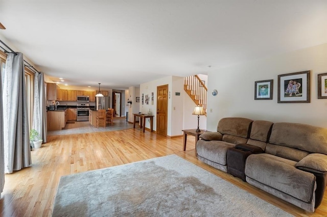 39 Grey Fox Lndg, Woodstock, CT 06281 - living room with light wood-type flooring and stairway