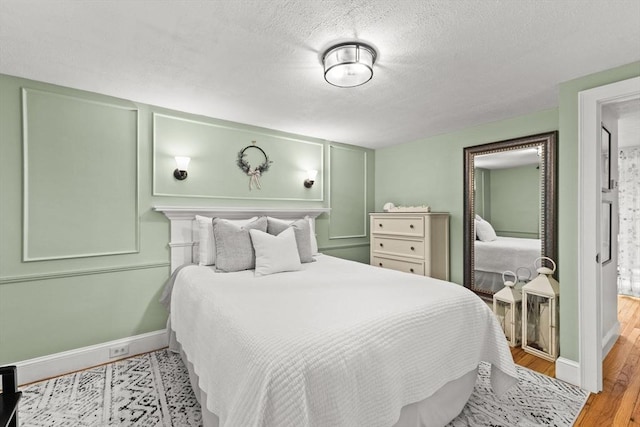 45 S Elm St, West Bridgewater, MA 02379 - bedroom featuring wood finished floors and a textured ceiling
