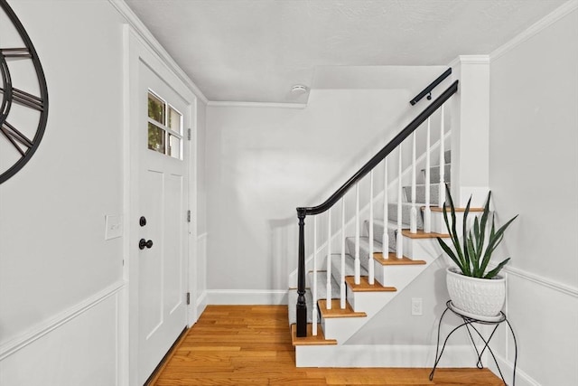 45 S Elm St, West Bridgewater, MA 02379 - foyer entrance featuring wood finished floors, stairway, and crown molding