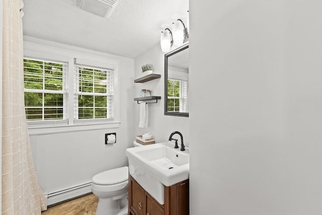 45 S Elm St, West Bridgewater, MA 02379 - bathroom with baseboard heating, vanity, and a textured ceiling