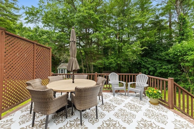 45 S Elm St, West Bridgewater, MA 02379 - wooden terrace with view of scattered trees and outdoor dining area