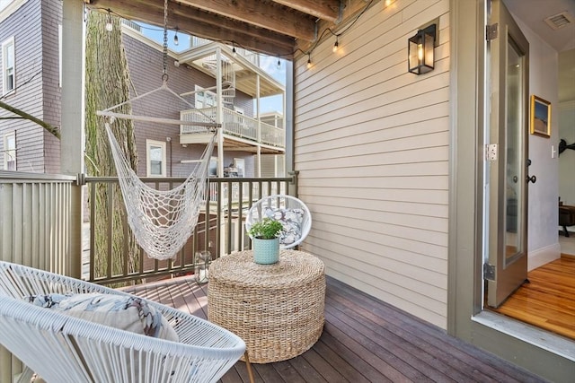 wooden deck with visible vents
