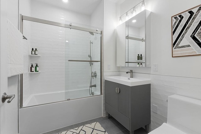 213 Harvard Unit 4, Cambridge, MA 02139 - bathroom with vanity, combined bath / shower with glass door, and tile patterned flooring