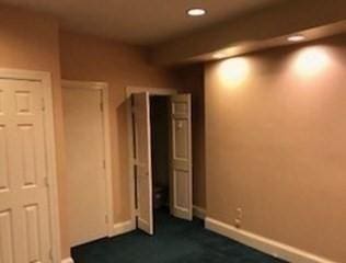 unfurnished bedroom with recessed lighting and baseboards