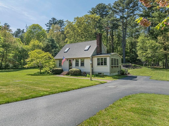 771 Ferry St, Marshfield, MA 02050 - view of front of property with a chimney, driveway, and a front lawn