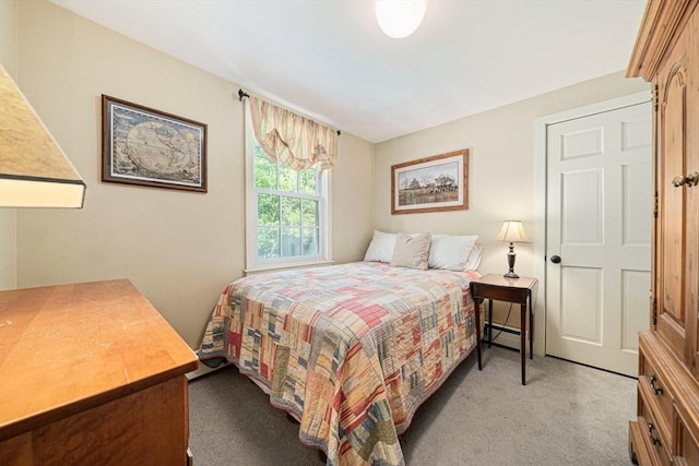 771 Ferry St, Marshfield, MA 02050 - bedroom with light carpet and a baseboard heating unit