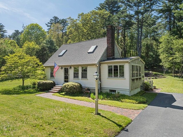 771 Ferry St, Marshfield, MA 02050 - view of front of home featuring a front yard and a chimney