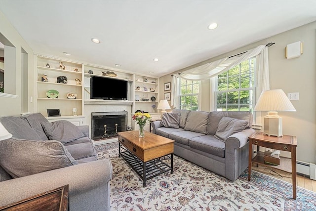 771 Ferry St, Marshfield, MA 02050 - living area featuring recessed lighting, a fireplace, wood finished floors, built in features, and baseboard heating