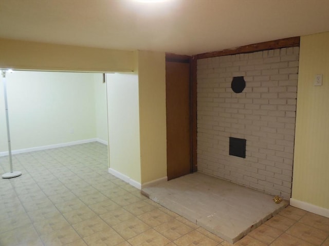 unfurnished room with a fireplace