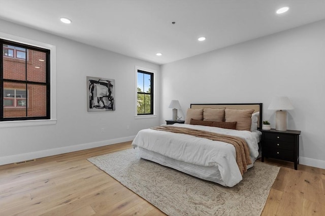 bedroom with light hardwood / wood-style flooring