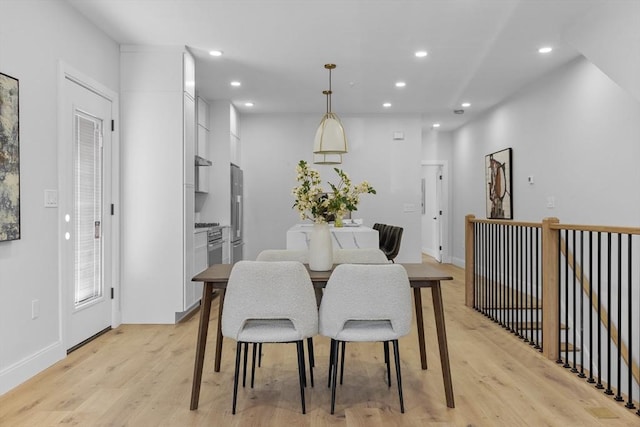 dining area featuring light wood-type flooring