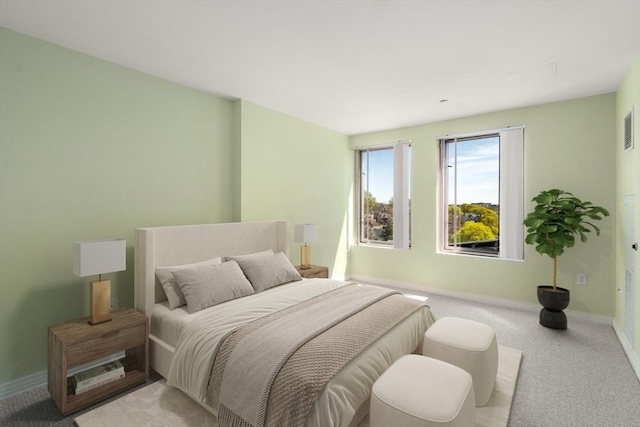 carpeted bedroom with baseboards