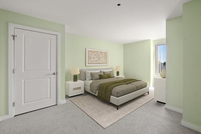 carpeted bedroom with baseboards