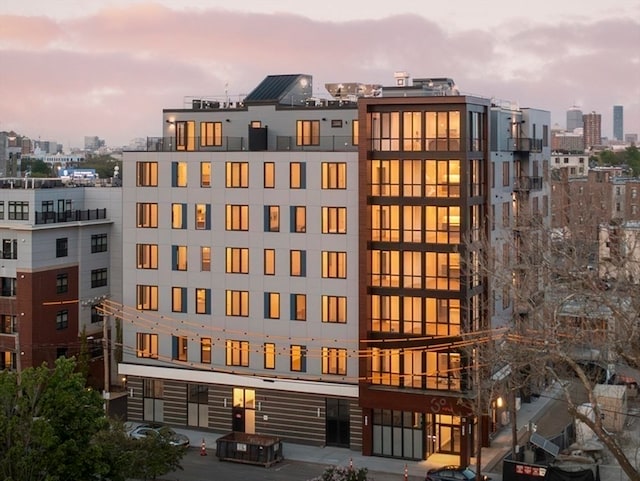 view of outdoor building at dusk