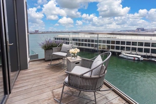 balcony featuring a water view