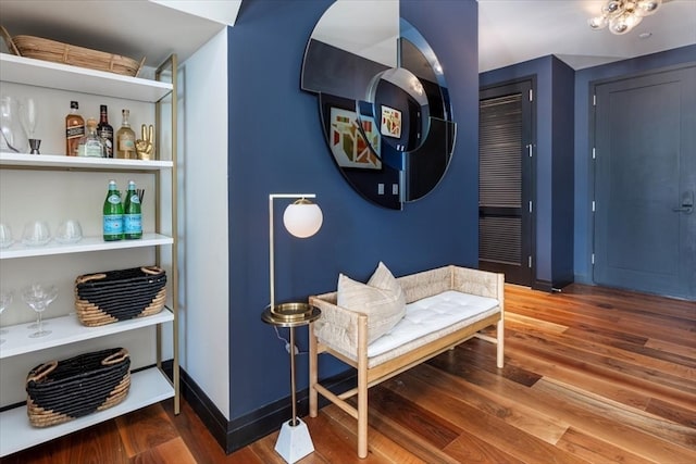 sitting room with hardwood / wood-style flooring