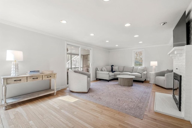 living area with crown molding and a wealth of natural light