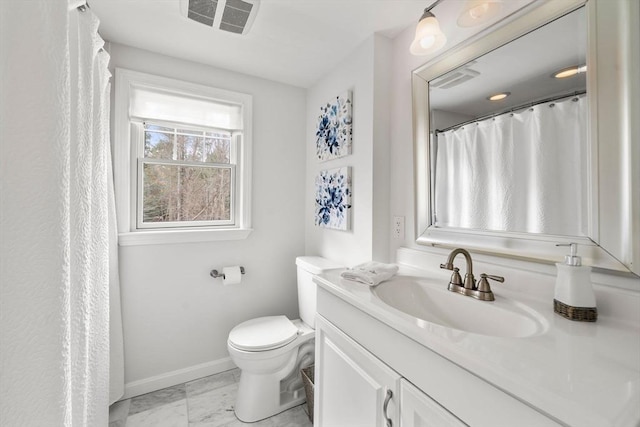 full bathroom featuring vanity, toilet, marble finish floor, baseboards, and visible vents