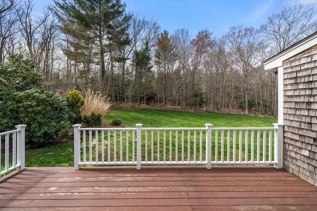 wooden terrace with a yard