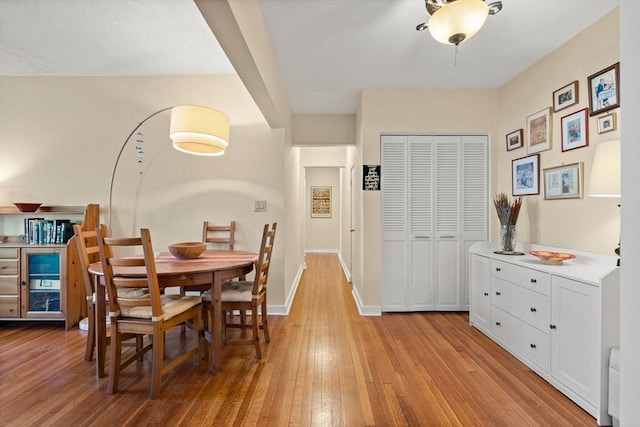 dining area with light hardwood / wood-style floors