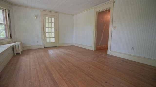 31 Burton St, Springfield, MA 01108 - spare room with light wood finished floors, radiator, ornamental molding, and wallpapered walls