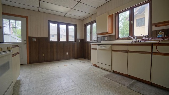 31 Burton St, Springfield, MA 01108 - kitchen featuring dishwasher, plenty of natural light, a drop ceiling, a wainscoted wall, and wood walls