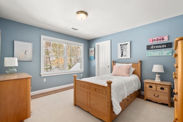 bedroom with visible vents and baseboards