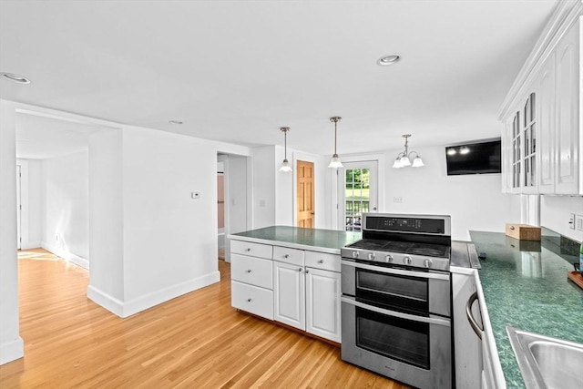67 Greenfield Ln, Scituate, MA 02066 - kitchen with double oven range, a peninsula, white cabinetry, light wood finished floors, and glass insert cabinets