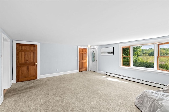 67 Greenfield Ln, Scituate, MA 02066 - unfurnished living room with a baseboard heating unit, carpet flooring, and baseboards