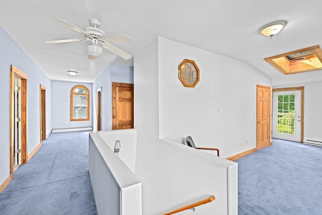 67 Greenfield Ln, Scituate, MA 02066 - hallway featuring light carpet, a baseboard heating unit, baseboards, baseboard heating, and vaulted ceiling