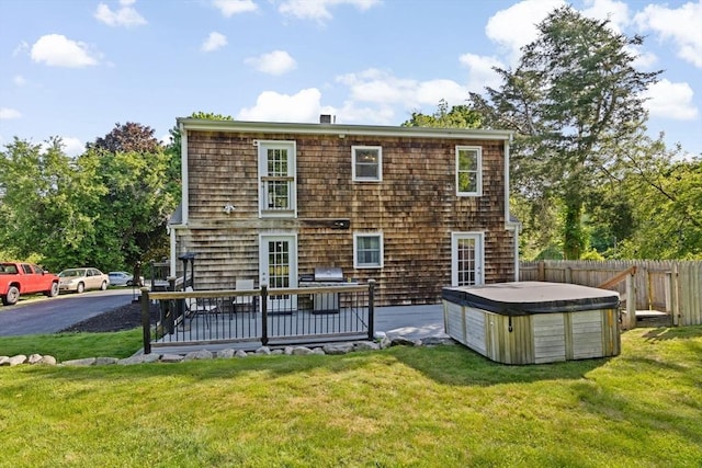 67 Greenfield Ln, Scituate, MA 02066 - rear view of property with a hot tub and a deck